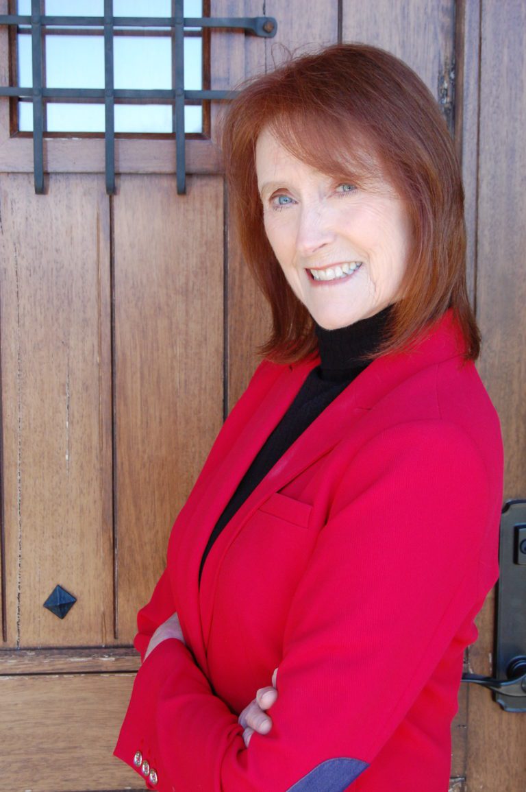 Alison Blasdell wearing red coat solo photo